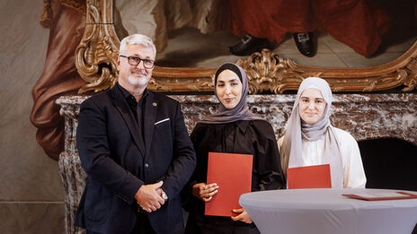 Students Sude Baysal and Palwascha Raschid at the award ceremony.