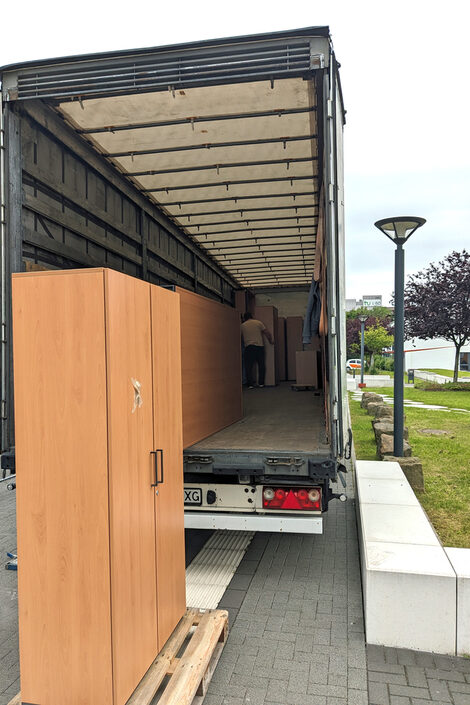 Furniture is loaded into a truck.